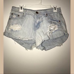 Mid rise distressed denim shorts